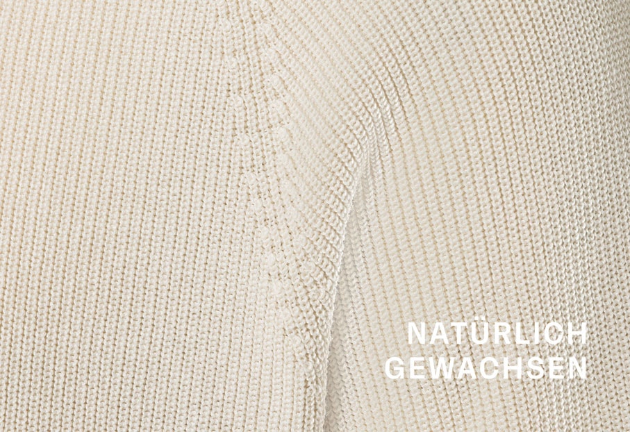 Detailansicht Premium Strickmode aus Bio-Baumwolle mit feiner Maschenstruktur, natürlich gewachsen, hochwertige Verarbeitung.