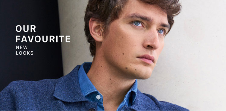 Our Favourite New Looks: Mann in tiefblauer Strickjacke und strukturiertem Strickhemd – moderne Premium Knitwear für hochwertige Herrenmode.
