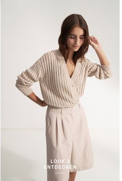 Look 3 entdecken: Our Favourite New Looks: Frau in feiner Strickjacke mit Midishorts, modern und reduziert inszeniert – eleganter Sommerlook zum Nachstylen.