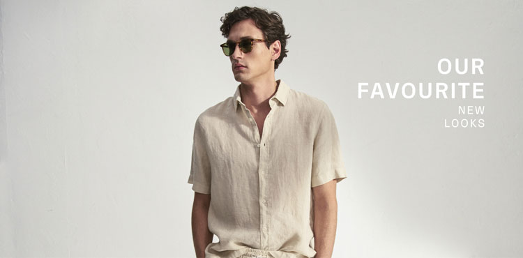 Our Favourite New Looks: Our Favourite New Looks: Mann im hellen Sommerlook aus Leinenhemd und Shorts, modern vor Studiohintergrund inszeniert.